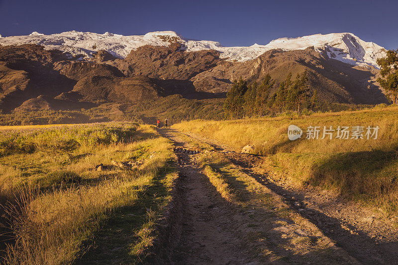 Country road into Cordillera Blanca valley and Huascaran massif at sunset – Ancash Andes near Huaraz, Peru